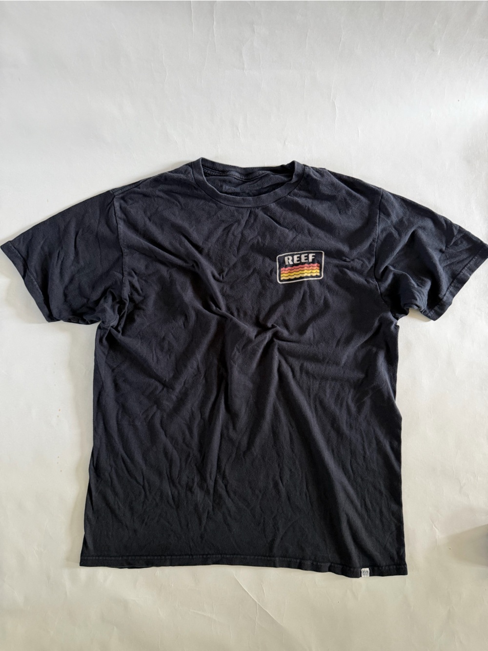 Reef Men's Navy Short Sleeve Tee with Multicolor Chest Patch - Picture 1 of 3